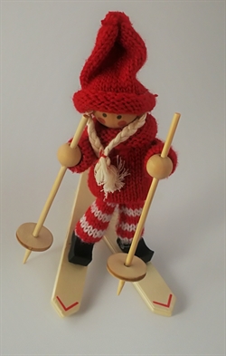 Nissepige på ski. Højde ca.13 cm.
