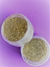 Lille dåse med skruelåg. Glimmer/glitter. Guld. Ca. 10 g.