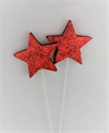 Et stk. Rød glitter stjerne på metalpind. Ø 6 cm.