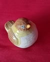 Et stk keramik fugl. Ca. 8 cm