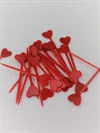 25 stk. Røde hjerter på pind. Plast. Længde ca. 8,5 cm. Hjertet er ca. 2 cm.