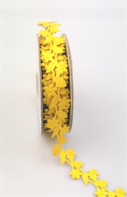 En rulle med ca. 9 meter bånd/blomster ranke selvklæbende. Flot gul..