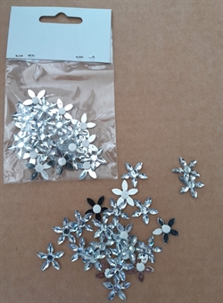 22-24 stk små Akryl blomster. Klæbepude på bagsiden.Ø ca. 0,8 cm.